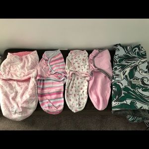 4 Infant sleep swaddles and a car seat canopy